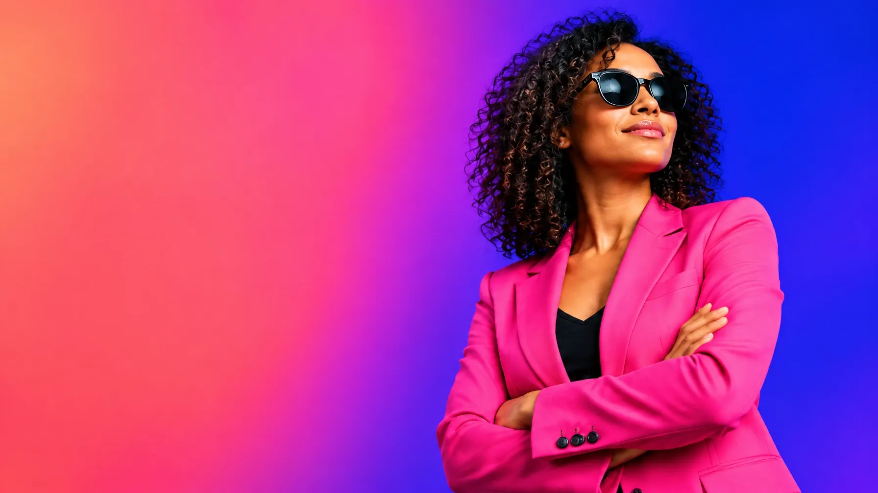 Confident entrepreneur in sunglasses and a bright pink blazer